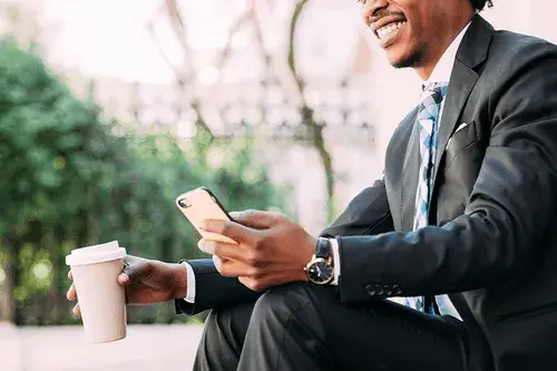 remote worker using his phone to work